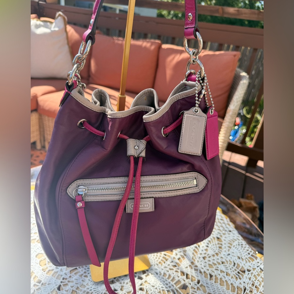 Coach Daisy spectator purple leather drawstring bucket bag.